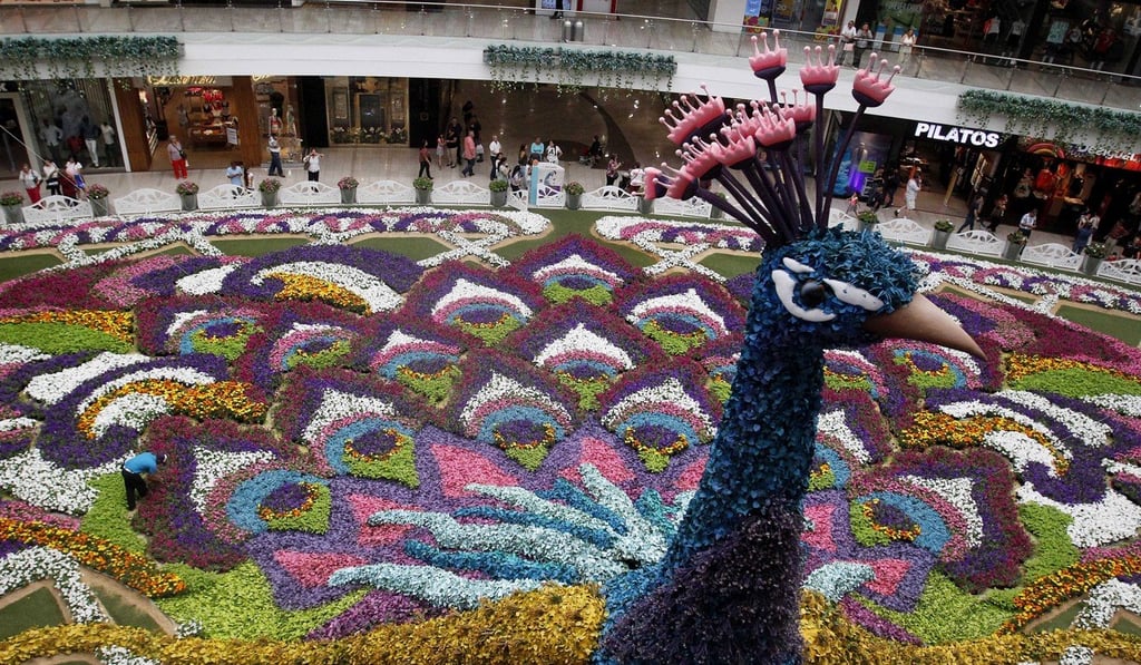 A general view of a giant Peacock and a carpet made with around 182,000 flowers during the 60th annual Flower Festival in Medellin, Colombia. Photo: EPA