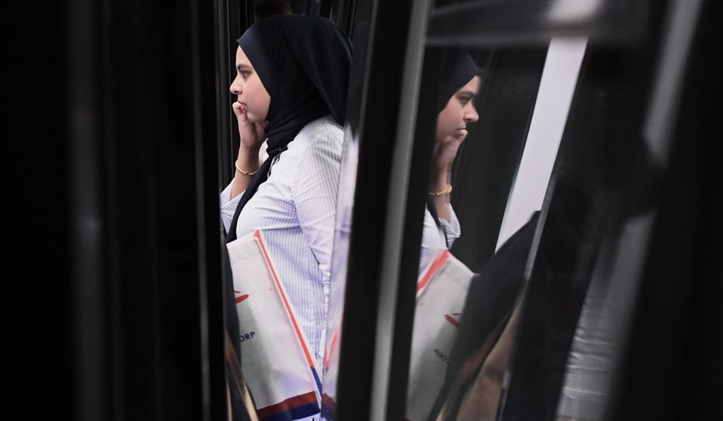 A woman disembarks from a Malaysia Mass Rapid Transit train after the official launch of the Sungai Buloh-Kajang line in Kuala Lumpur. Photo: AFP A woman disembarks from a Malaysia Mass Rapid Transit train after the official launch of the Sungai Buloh-Kajang line in Kuala Lumpur. Photo: AFP
