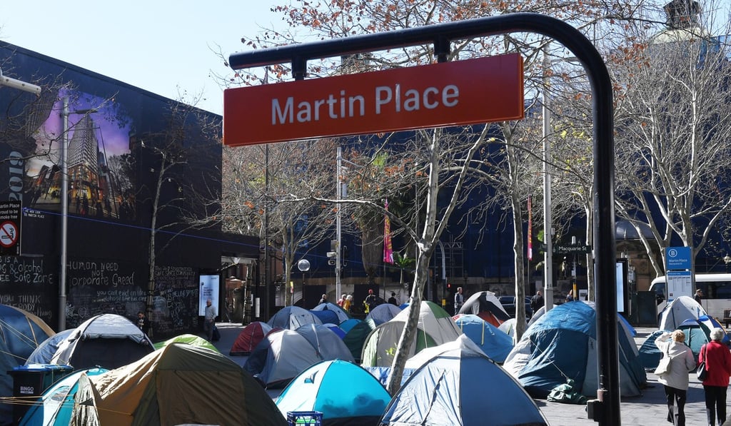 There are an estimated 35 tents in the central strip, which are directly adjacent to the main entrance to The Reserve Bank of Australia. Photo: EPA There are an estimated 35 tents in the central strip, which are directly adjacent to the main entrance to The Reserve Bank of Australia. Photo: EPA