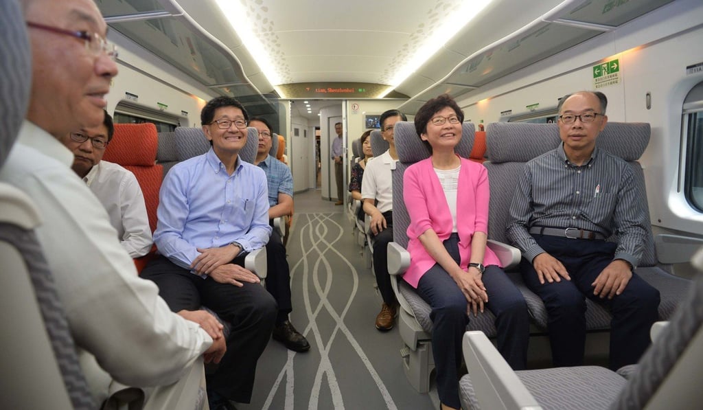 Chief Executive Carrie Lam Cheng Yuet-ngor and the transport secretary, Frank Chan Fan (right), try out an express rail coach delivered to Hong Kong, on July 9. Photo: Handout