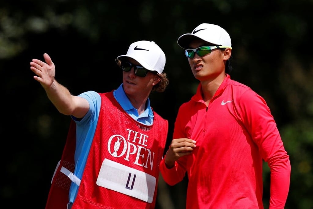 China’s Li Haotong Li speaks to his caddie during the third round of the British Open. Photo: Reuters