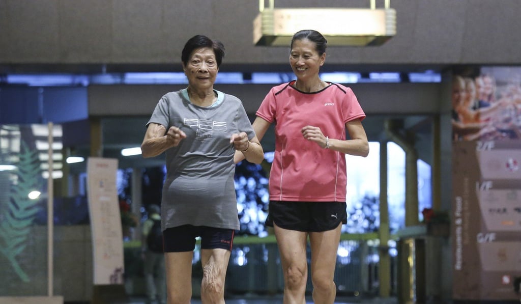 Hong Kong competitive runner Cheung Suet-ling, aged 93, and her daughter Lai Yin-mei train in Wan Chai. Photo: Dickson Lee