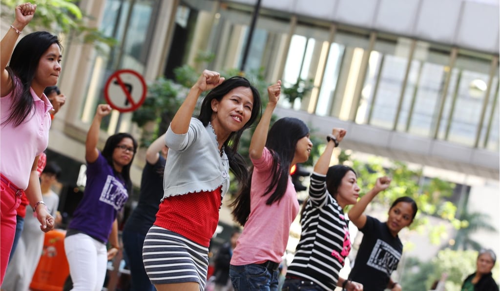 Filipino domestic workers make the most of their day off, in Chater Road, Central. Photo: Nora Tam