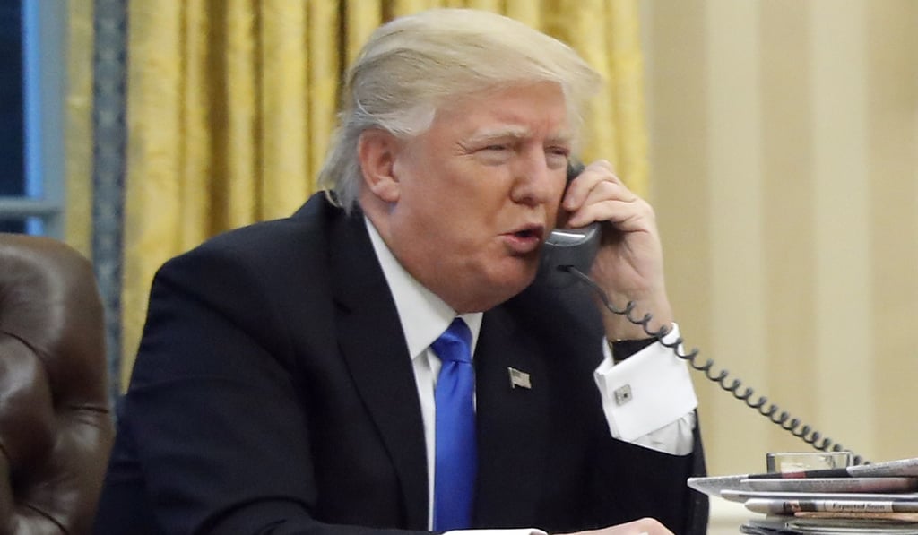 President Donald Trump speaks on the phone with Australian Prime Minister Malcolm Turnbull in the Oval Office of the White House. Photo: AP