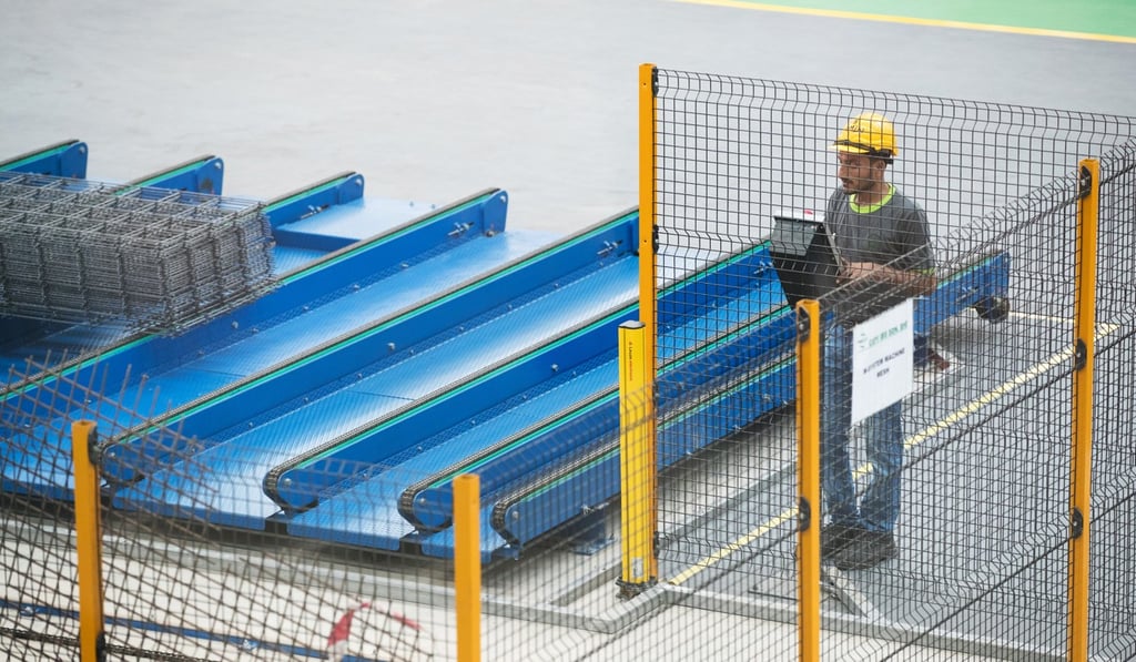 A worker in the Iskandar development zone. Photo: Bloomberg A worker in the Iskandar development zone. Photo: Bloomberg
