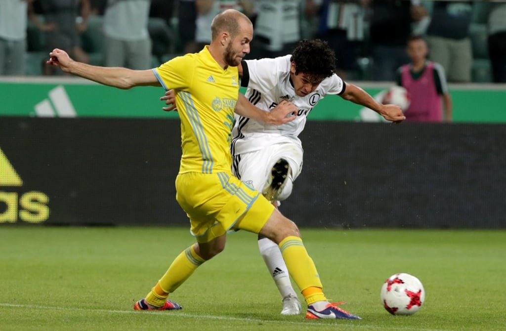 Legia Warsaw's Guilherme (right) and FC Astana's Ivan Maevski. Photo: EPA