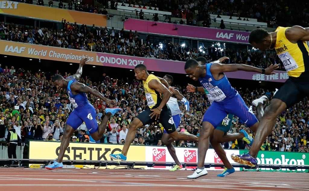 Gatlin of the United States and Jamaican Bolt sprint to the finish line at the IAAF World Championships in London. Photo: Xinhua