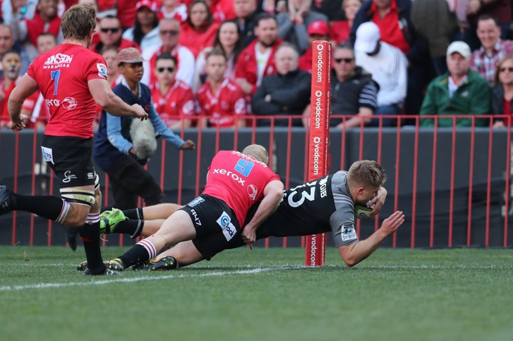 Joe Moody of the Crusaders scores a try as he is tackled by Ross Cronje of the Lions. Photo: EPA Joe Moody of the Crusaders scores a try as he is tackled by Ross Cronje of the Lions. Photo: EPA