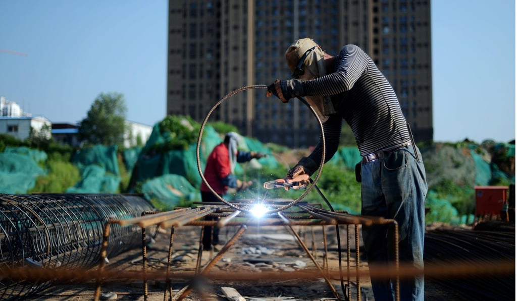 Men at work at a construction site in Jinan, Shandong province. China and the emerging economies will overtake the US and developed economies by 2050. Photo: Reuters
