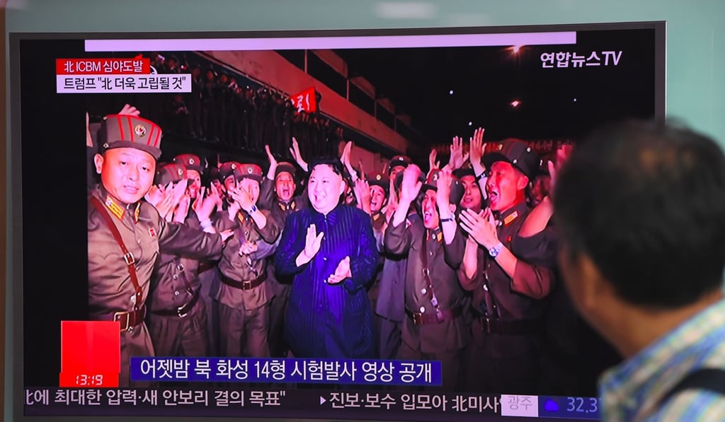 Television footage of North Korean leader Kim Jong-un welcoming the North’s latest test launch of an intercontinental ballistic missile. Photo: AFP