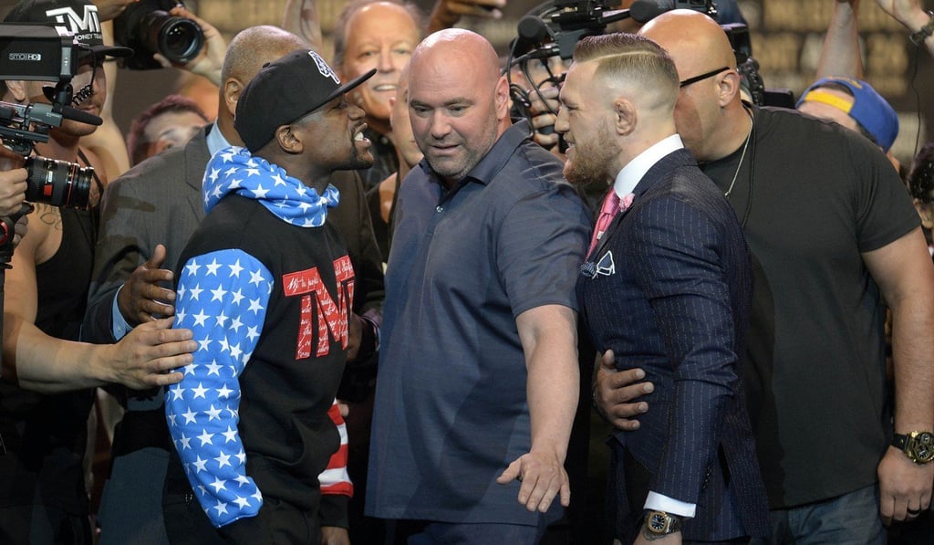 UFC president Dana White separates Floyd Mayweather and Conor McGregor. Photo: Reuters. Photo: USA Today Sports