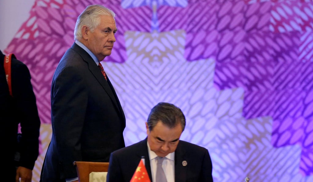 US Secretary of State Rex Tillerson (left) passes Chinese Foreign Minister Wang Yi at the Asean forum in Manila. Photo: Reuters
