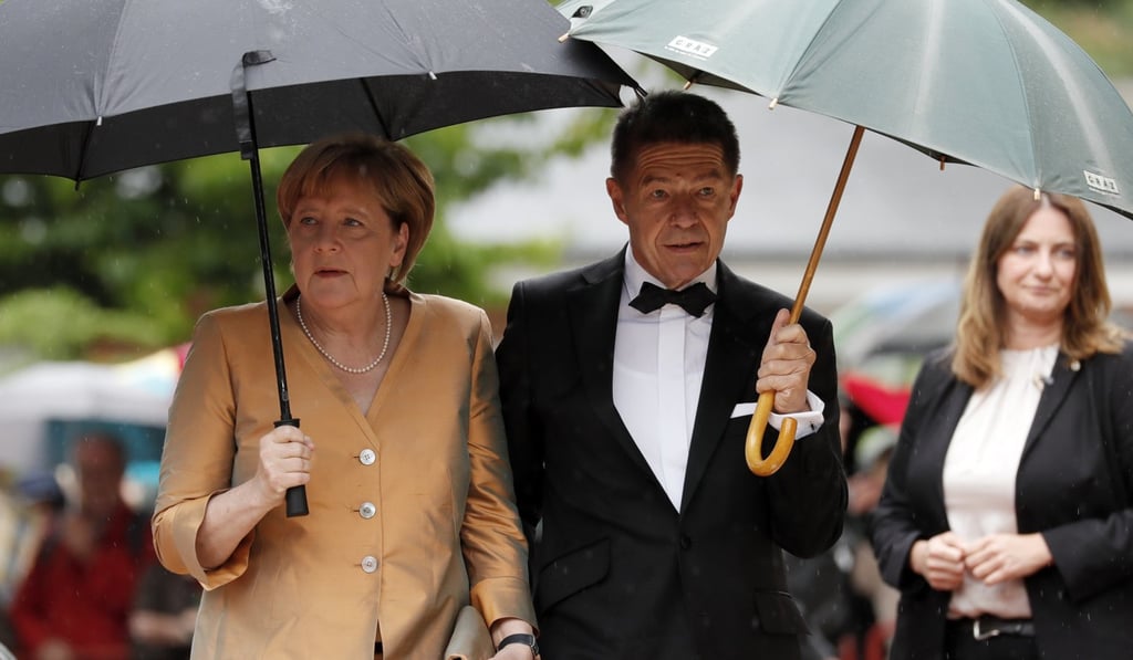 German Chancellor Angela Merkel (L) and her husband Joachim Sauer arrive for the opening of the 106th Bayreuth Festival at the Richard-Wagner-Festspielhaus (Bayreuth Festspielhaus), in Bayreuth, Germany. Turkey accused Germany of coddling terrorists. Photo: EPA German Chancellor Angela Merkel (L) and her husband Joachim Sauer arrive for the opening of the 106th Bayreuth Festival at the Richard-Wagner-Festspielhaus (Bayreuth Festspielhaus), in Bayreuth, Germany. Turkey accused Germany of coddling terrorists. Photo: EPA