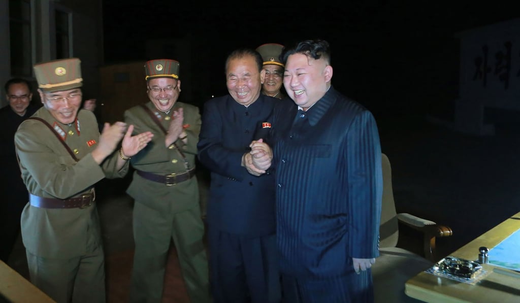 This July 28 picture released by North Korea's official Korean Central News Agency shows North Korean leader Kim Jong-un (right) celebrating a test launch of an intercontinental ballistic missile. Photo: AFP