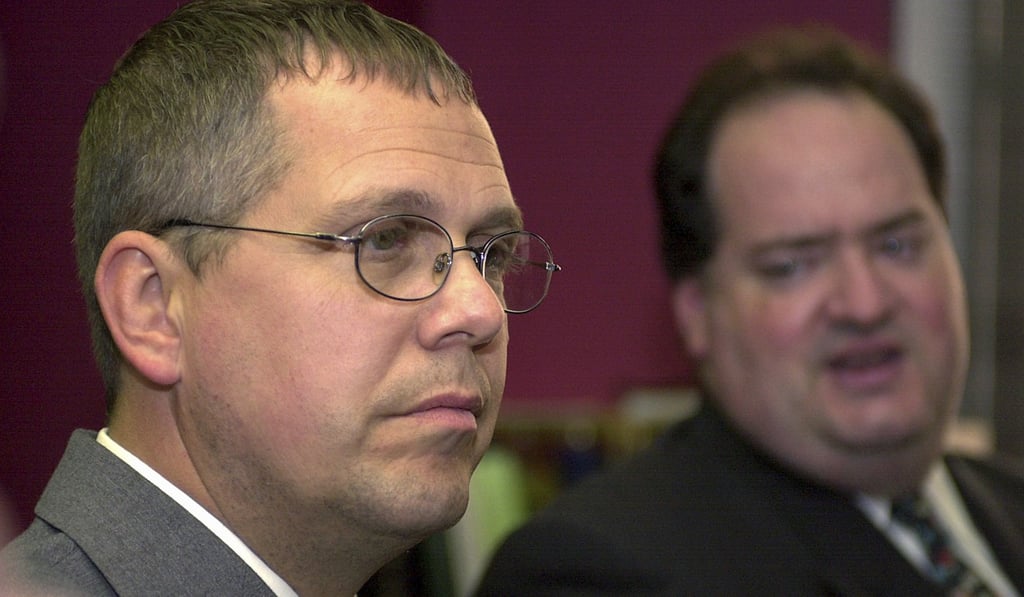 Inn this September 8, 2005 file photo, Customs and Border Protection Officer Robert Rhodes listens to his defence lawyer, Steven Cohen, after Rhodes was found not guilty in the assault of Zhao Yan at the Rainbow Bridge Plaza in Niagara Falls. But on Monday, a federal judge ruled in favour of Zhao in her civil suit against the US government. Photo: AP Inn this September 8, 2005 file photo, Customs and Border Protection Officer Robert Rhodes listens to his defence lawyer, Steven Cohen, after Rhodes was found not guilty in the assault of Zhao Yan at the Rainbow Bridge Plaza in Niagara Falls. But on Monday, a federal judge ruled in favour of Zhao in her civil suit against the US government. Photo: AP