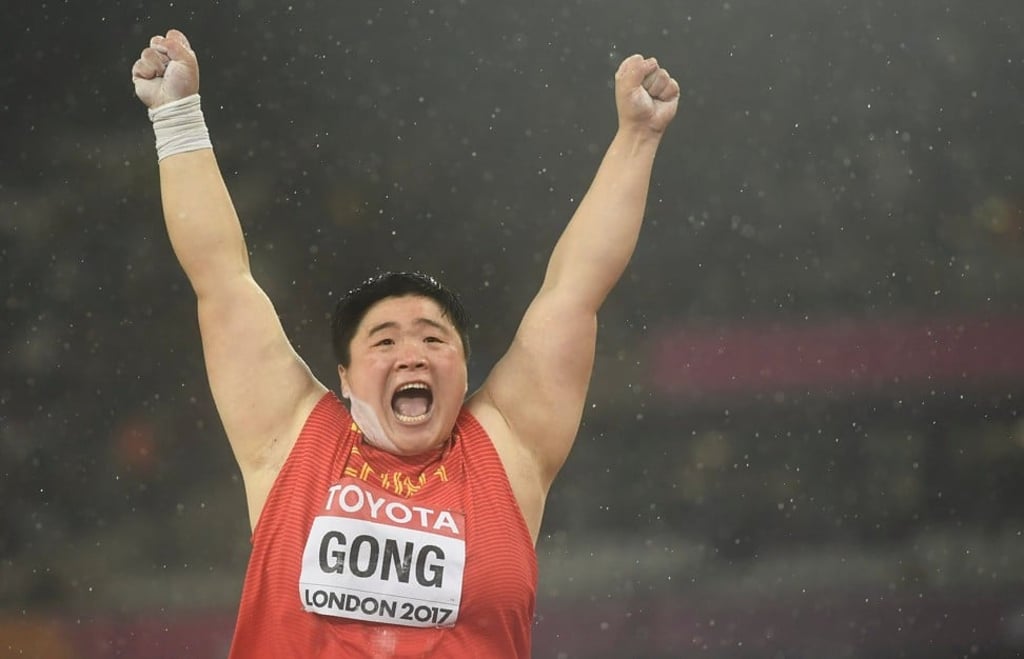 Gong celebrates after winning the final. Photo: Reuters