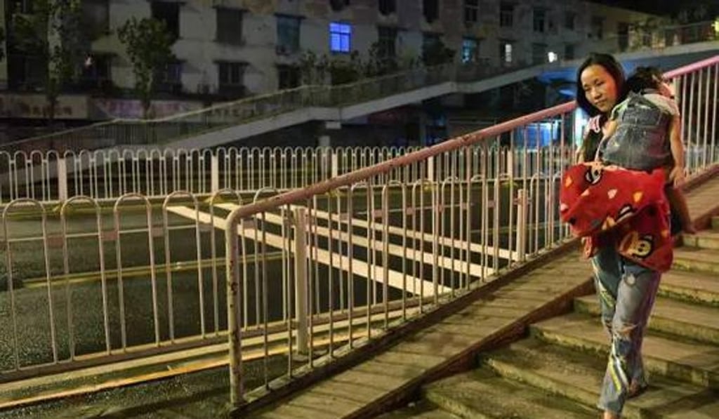 Li walks home with Yiyi after a night at work. Photo: Handout