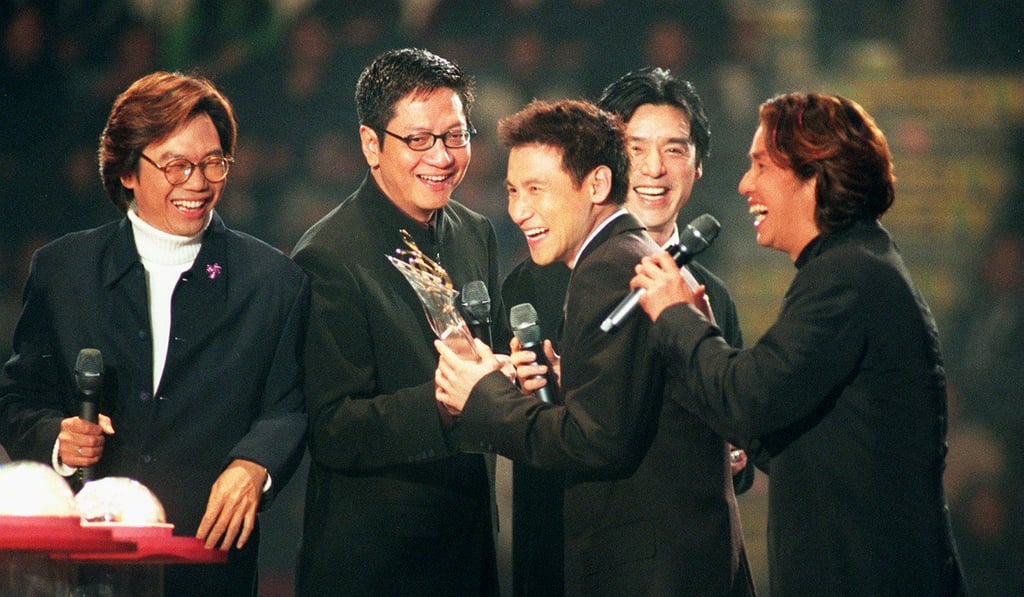 Dyeing one’s hair was as popular in the 1990s as it is now as seen in this 1999 picture showing members of local pop band Wynners present an award to Canto-pop star Jacky Cheung (centre) at an event at the Hong Kong Coliseum. Picture: SCMP
