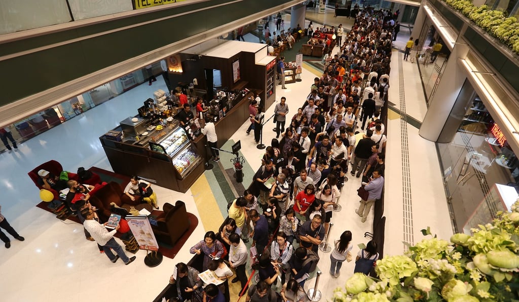 Potential buyers line up at the sales office for a residential project in Hong Kong. Picture: SCMP