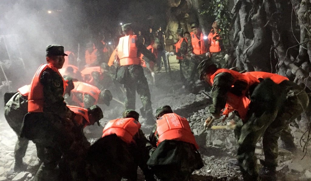 Chinese paramilitary police search for survivors after an earthquake in Jiuzhaigou in southwest China's Sichuan province. Photo: AFP
