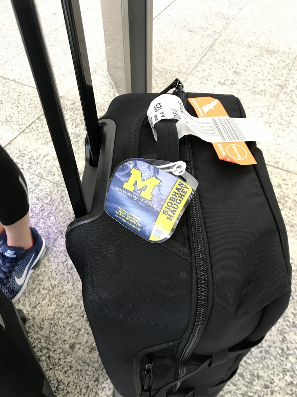 Siobhan Haughey’s University of Michigan bag on her arrival back to Hong Kong. Photo: Chan Kin-wa