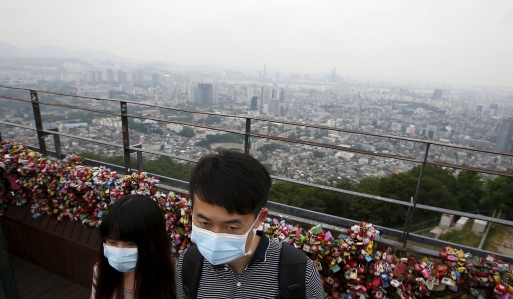 A couple wear masks to guard against contracting Mers in Seoul in 2015, when South Korea was hit with an outbreak of the coronavirus. Photo: Reuters