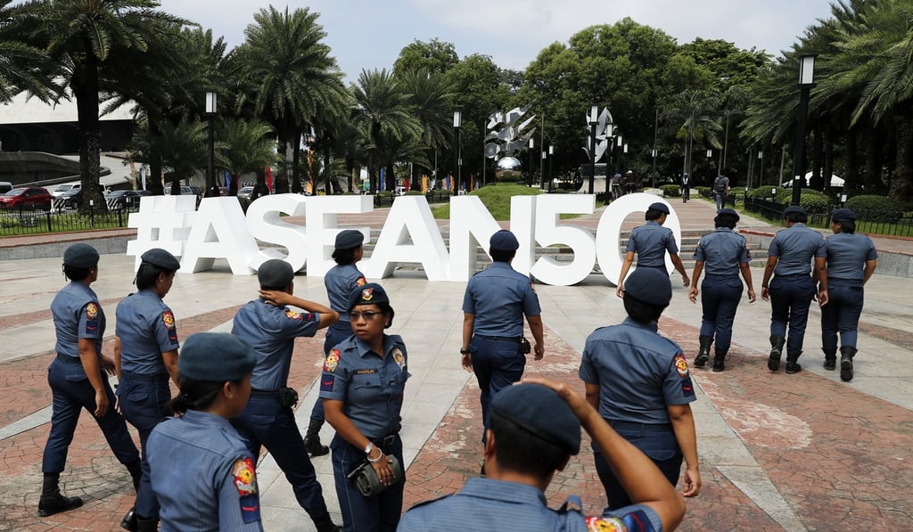 Policemen patrol near the venue of the Asean meeting in Manila. Photo: EPA