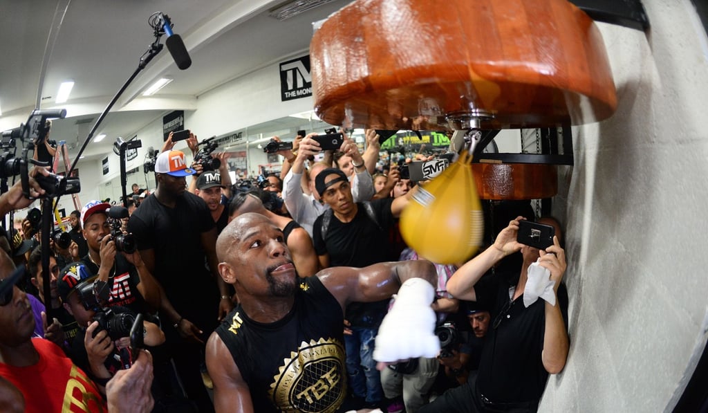 Floyd Mayweather hits a speed bag during a media workout in preparation for his fight against Conor McGregor. Photo: USA TODAY Sports