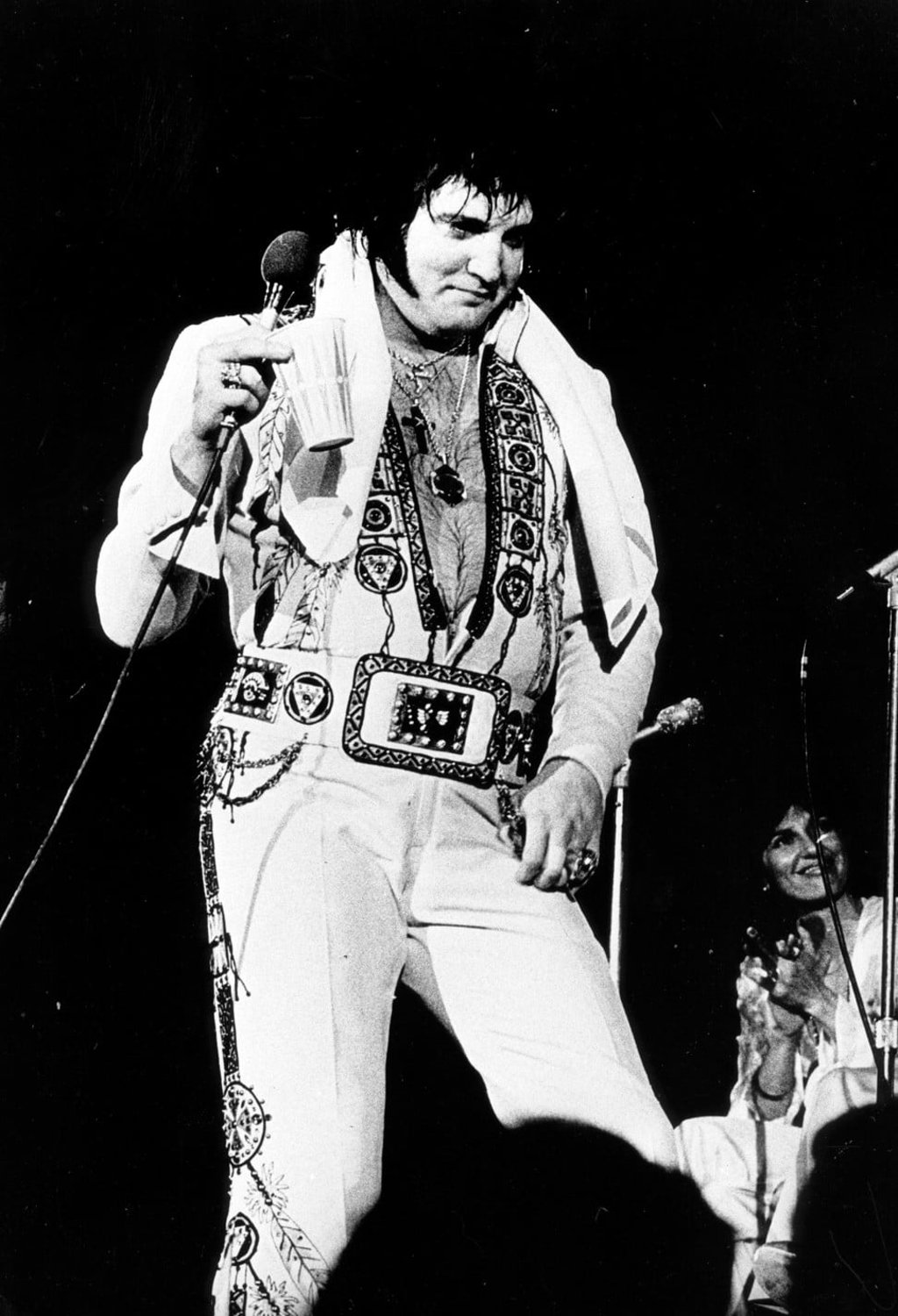 Elvis in his overweight pill-popping days at one of his final concerts in 1977. Photo: Alamy