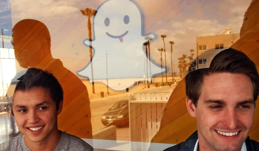 Bobby Murphy, 24, left, and Evan Spiegel, 22, co-creators of Snapchat, are seen through a window of the company's offices. Photo: Los Angeles Times/TNS Bobby Murphy, 24, left, and Evan Spiegel, 22, co-creators of Snapchat, are seen through a window of the company's offices. Photo: Los Angeles Times/TNS