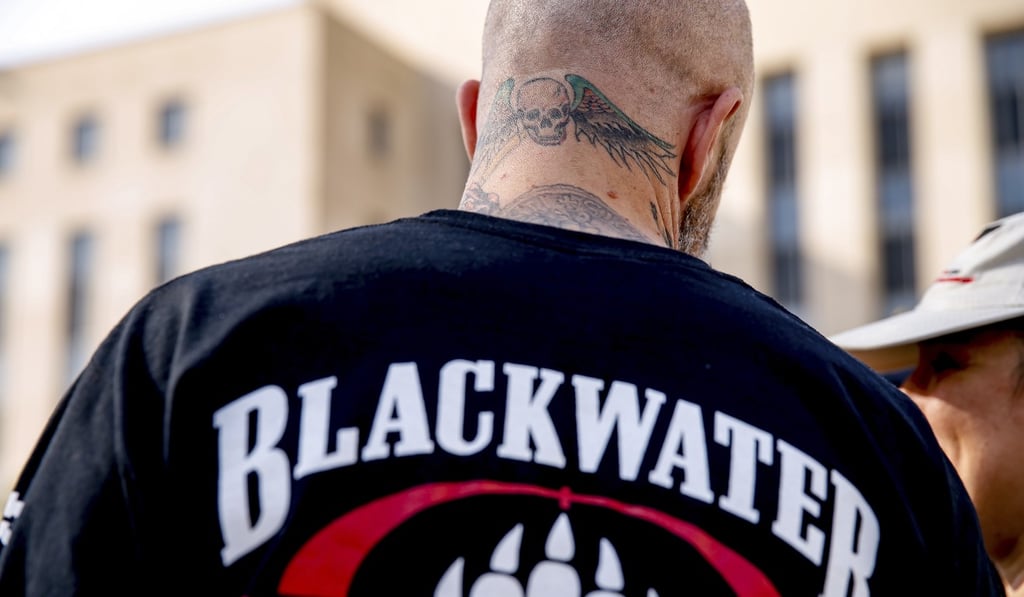 A former member of Blackwater joins family members, friends, and supporters of four former Blackwater security guards outside a federal court in Washington in 2015. Photo: AP