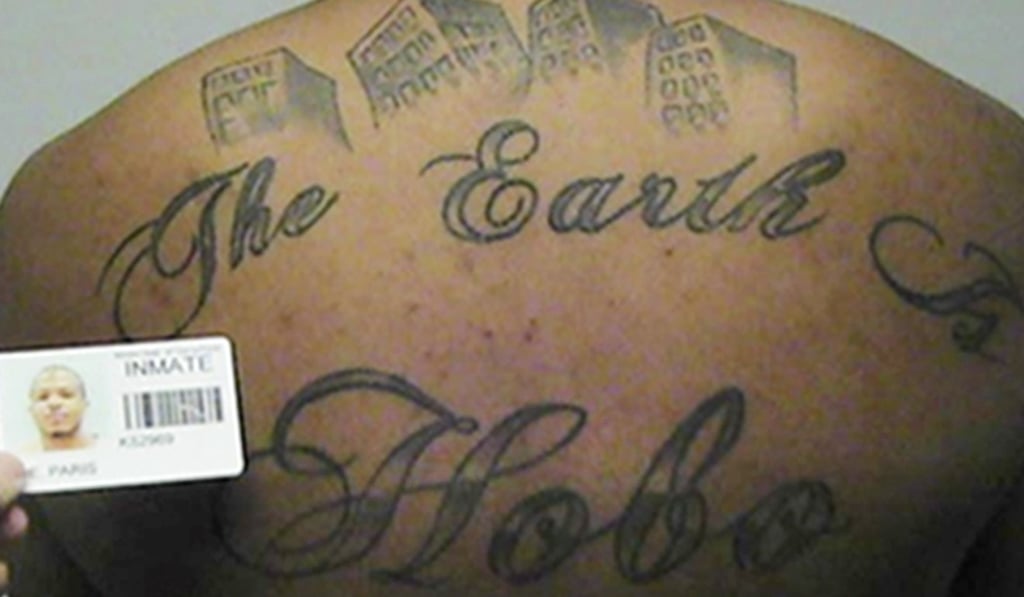 File photo in a court filing provided by the United States Attorney's office in Chicago shows Paris Poe's back tattoo that reads “The Earth Is Our Turf”, and “Hobo.” Photo: United States Attorney's office in Chicago via AP