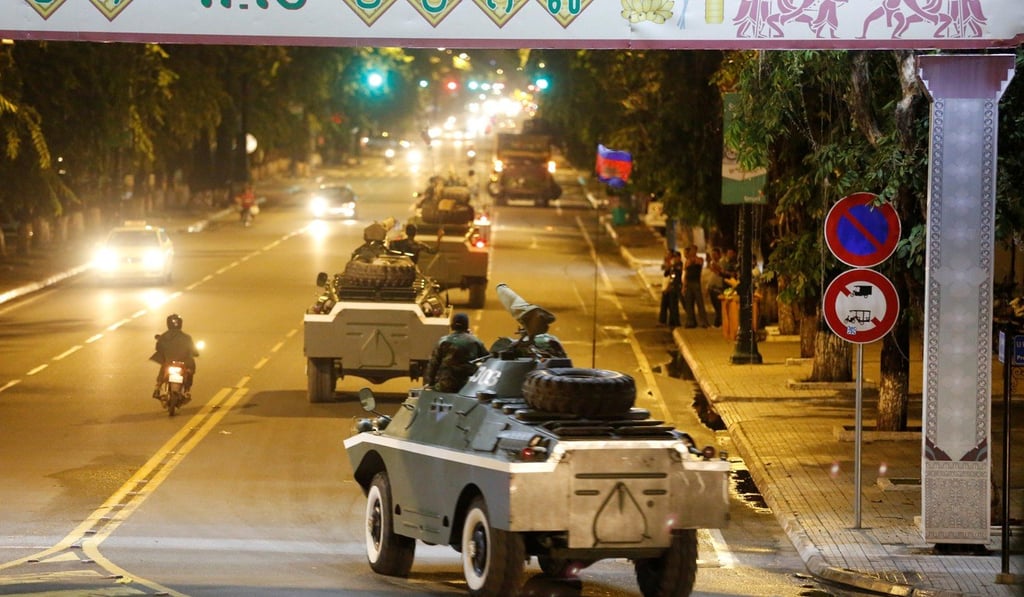 Army vehicles are seen along a street in Phnom Penh, Cambodia. Photo: Reuters