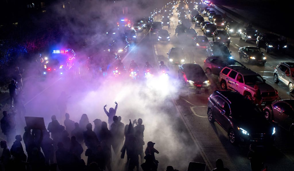 Protesters block both directions of a freeway in Oakland, California. Photo: AFP Protesters block both directions of a freeway in Oakland, California. Photo: AFP