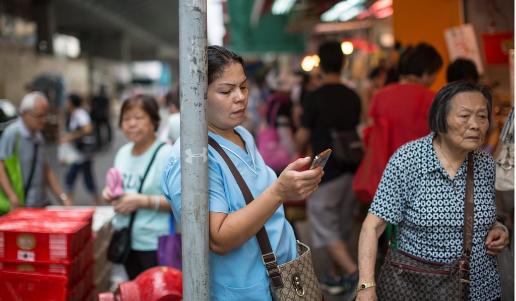 Some contend that if a person is unable to have a conversation in the local language with a taxi driver or vegetable seller in the wet market, then he cannot be considered a local. Photo: EPA