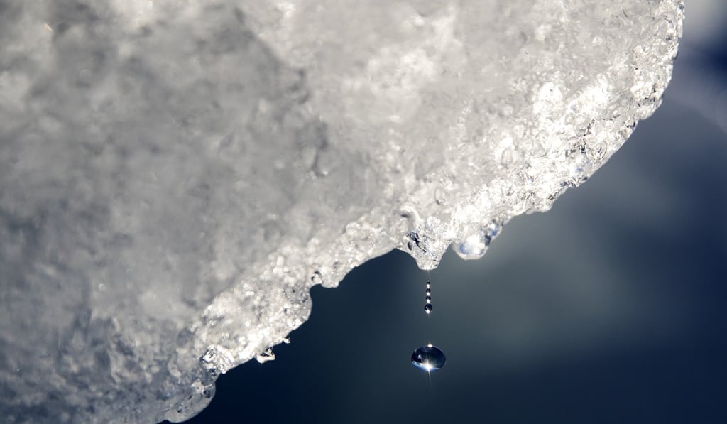 A drop of water falls off an iceberg melting in the Nuup Kangerlua Fjord in southwestern Greenland. Studies show the Arctic is heating up twice as fast as the rest of the planet. Photo: AP