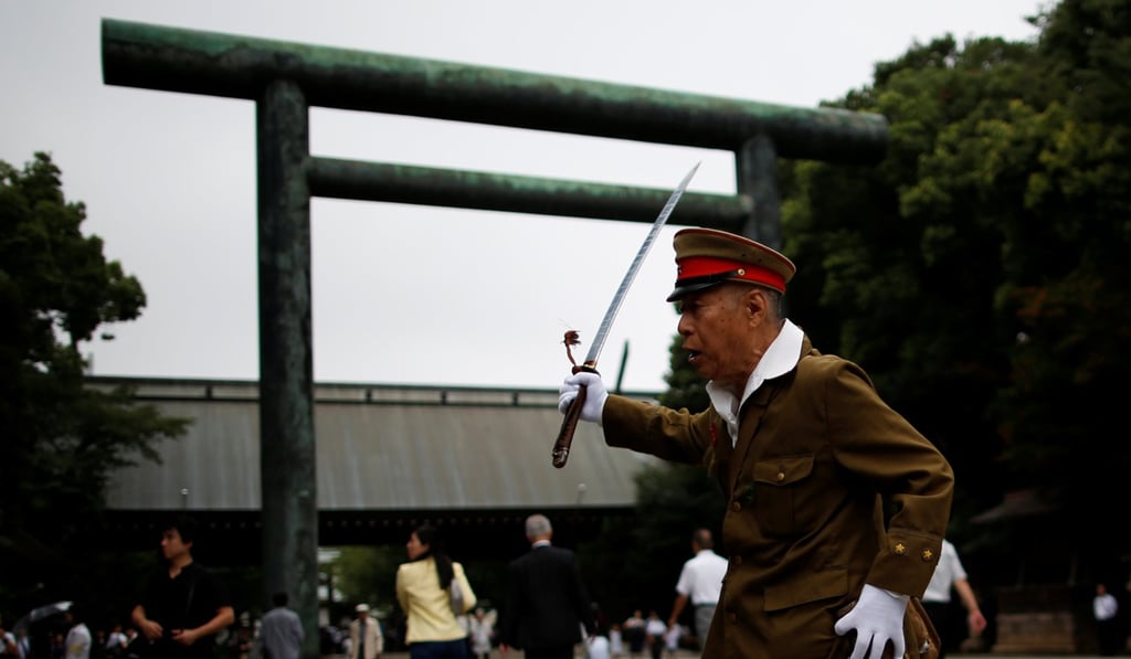 A man dressed as a Japanese imperial army soldier stands at Yasukuni Shrine in Tokyo. Photo: Reuters