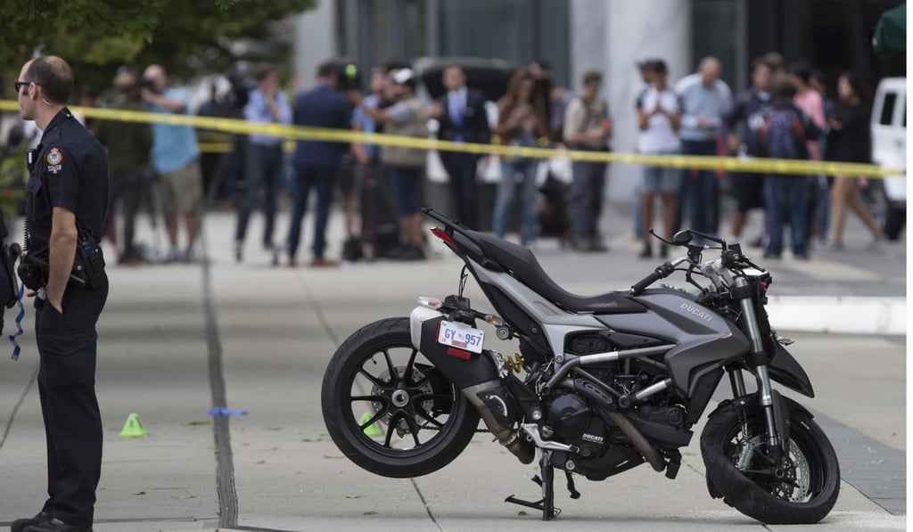A police officer stands by the motorcycle that was involved in the fatal incident in which a female stunt driver working on the movie Deadpool 2 died in Vancouver on Monday. Photo: AP A police officer stands by the motorcycle that was involved in the fatal incident in which a female stunt driver working on the movie Deadpool 2 died in Vancouver on Monday. Photo: AP