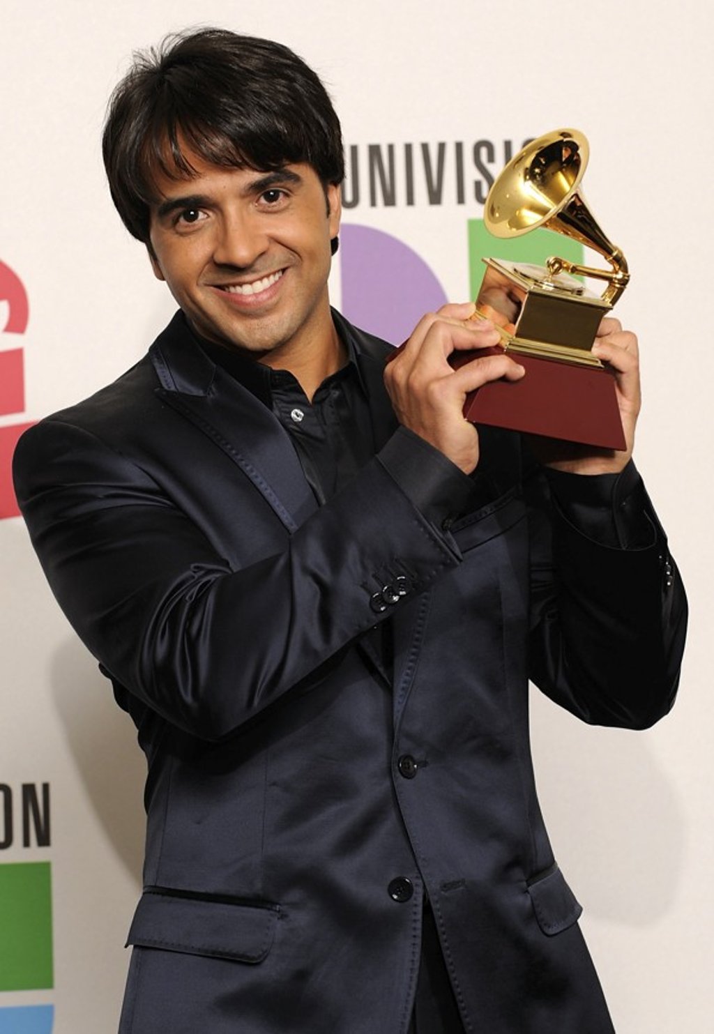 Fonsi with his Grammy Award for song of the year in 2009. Picture: AFP