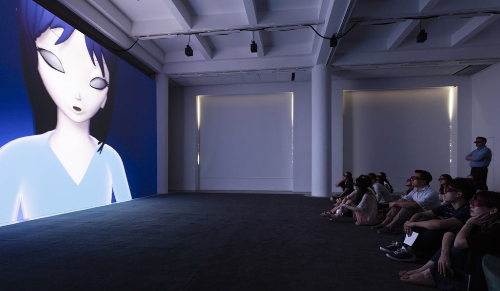 An audience watching the 3D animated version of Parreno’s Anywhere Out of the World, featuring Annlee the alien.
