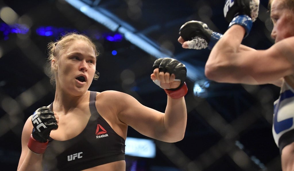 Former bantamweight champion Ronda Rousey (left) suffered her first defeat in UFC to Holly Holm in November 2015. Photo: AFP