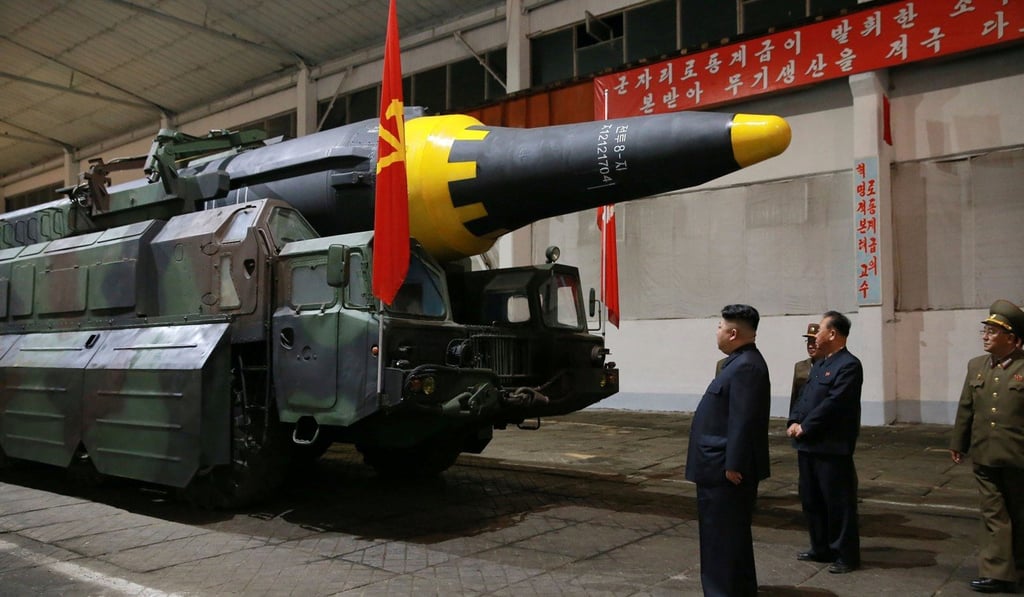 North Korean leader Kim Jong-un inspects the long-range strategic ballistic rocket Hwasong-12 in this undated photo released by North Korea's Korean Central News Agency in May. Photo: KCNA via Reuters