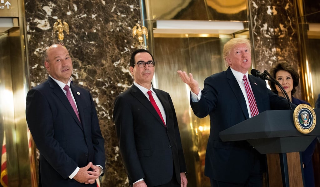 US President Donald Trump delivers remarks following a meeting on infrastructure at Trump Tower on Tuesday with Director of the National Economic Council Gary Cohn (left), Treasury Secretary Steve Mnuchin, and Transportation Secretary Elaine Chao. Photo: AFP US President Donald Trump delivers remarks following a meeting on infrastructure at Trump Tower on Tuesday with Director of the National Economic Council Gary Cohn (left), Treasury Secretary Steve Mnuchin, and Transportation Secretary Elaine Chao. Photo: AFP