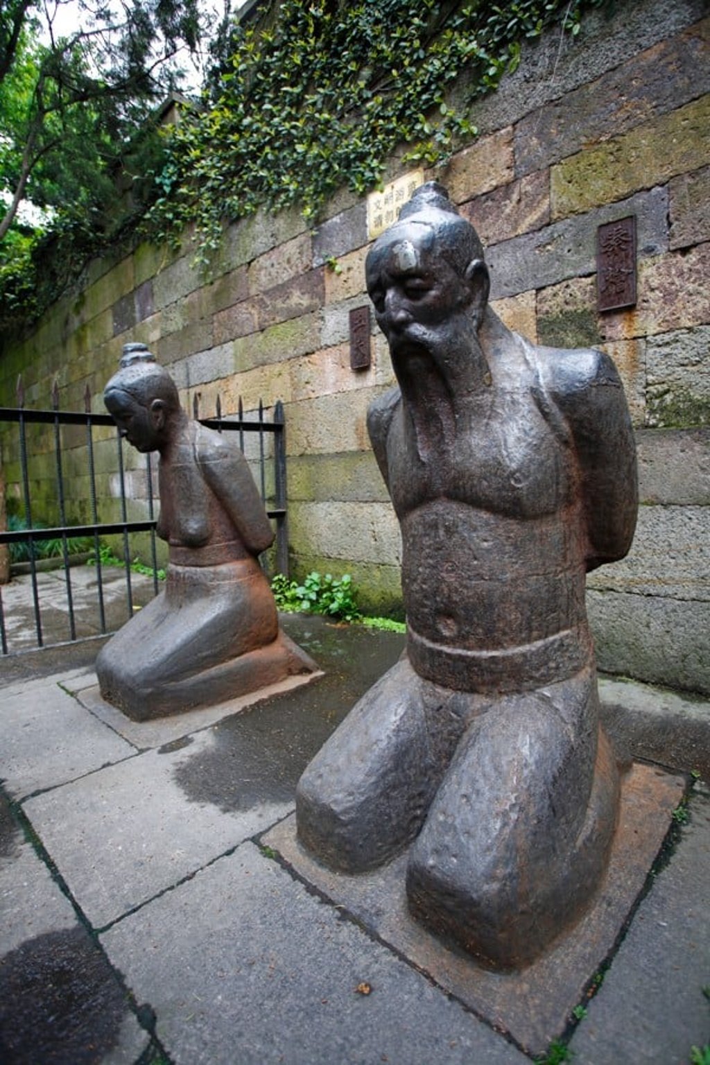 Statues of China’s public enemy No 1, Qin Hui, a Song-dynasty prime minister, and his wife, Lady Wang, at the Yue Fei temple, in Hangzhou. Picture: Alamy