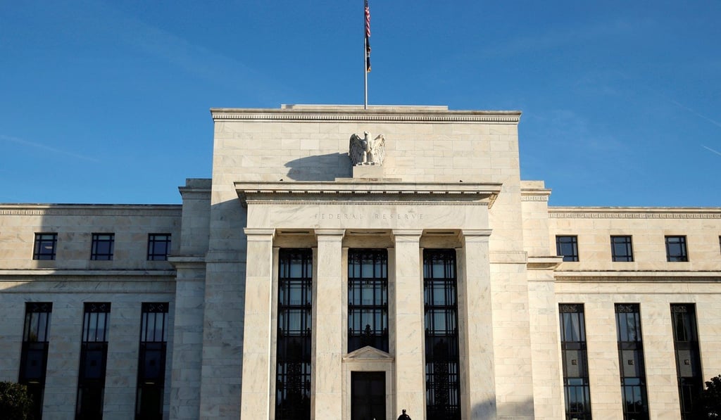 A police officer keeps watch in front of the US Federal Reserve in Washington. Photo: Reuters