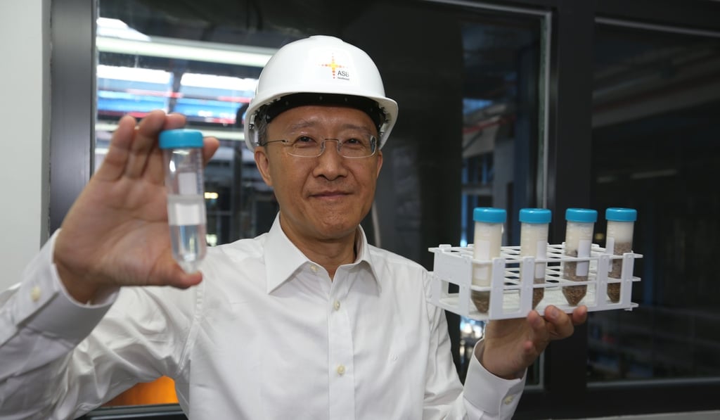 Cheung Siu-ming displays the biodiesel distilled from the palm oil globs. Photo: Xiaomei Chen