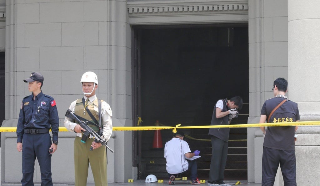 A man was arrested after he attacked a military police officer at the Presidential Office Building in Taipei on Friday. Photo: CNA Pictures