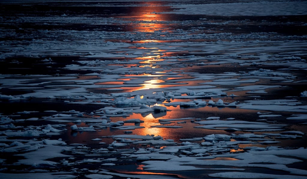 The midnight sun shines across sea ice along the Northwest Passage in the Canadian Arctic Archipelago, Sunday, July 23, 2017. The melting ice is one reason why modern ships have an easier time going through the Northwest Passage, 111 years after Norwegian adventurer Roald Amundsen achieved the first transit. Early explorers found themselves blinded by harsh sunlight reflecting off a desert of white, confused by mirages that give the illusion of giant ice cliffs all around, and thrown off course by the proximity of the North Pole distorting their compass readings. Photo: AP