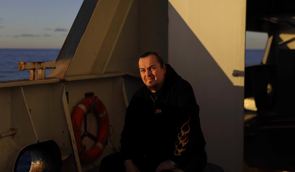 Deck repairman Mika Koponen, 41, sits for a portrait aboard the Finnish icebreaker MSV Nordica as the ship sails the Amundsen Gulf in the Arctic, Wednesday, July 19, 2017. Koponen, who is making his first traverse through the Northwest Passage, started sailing at the age of 15 after following in his brother's footsteps.
