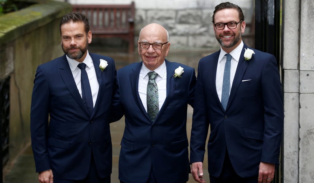 Media mogul Rupert Murdoch (centre) poses for a photograph with his sons Lachlan (left) and James as they arrive at St Bride's church for a service to celebrate the wedding between Murdoch and former supermodel Jerry Hall in London last year. Photo: Reuters
